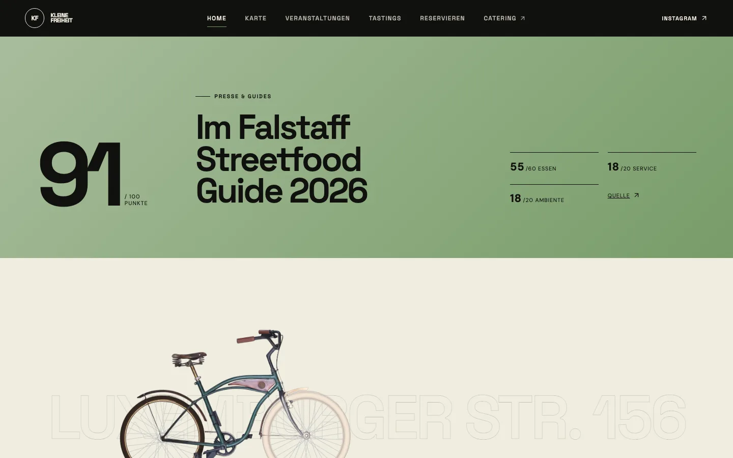Falstaff-Band mit 91 von 100 Punkten, aufgeschlüsselt nach Essen, Service und Ambiente, darunter das Fahrrad vor der Adresse